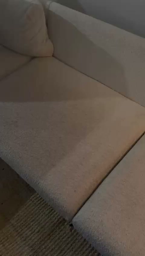 Beige fabric couch partway through an in-home cleaning in Los Angeles, with the cleaned part of the seat cushions visibly lighter than the rest